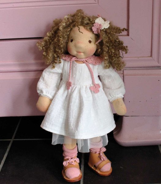 Soft doll sold with her clothes and accessories