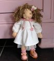 Soft doll sold with her clothes and accessories