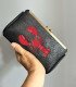 Embroidered glitter leather clutch bag